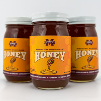 Three 22 oz jars of wildflower honey