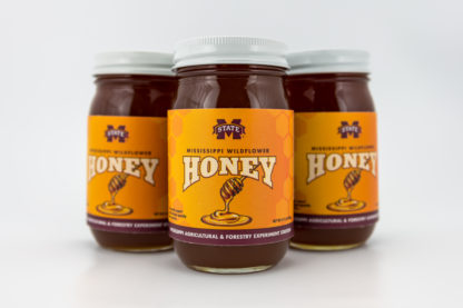 Three 22 oz jars of wildflower honey
