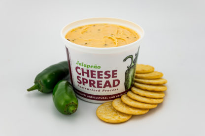 22 oz jalapeno pepper cheese spread with crackers and jalapeno peppers