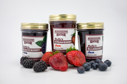 9 oz blackberry jam, 9 oz strawberry jam, 9 oz blueberry jam surrounded by fruit