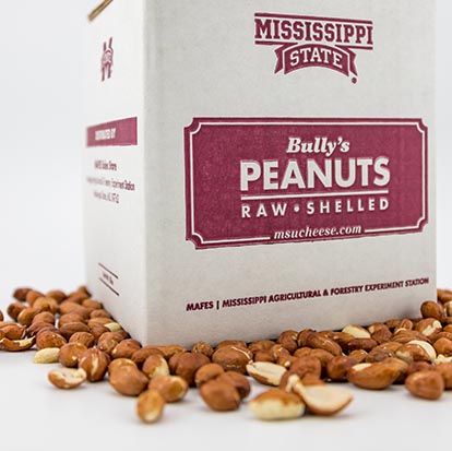 5lb box of raw peanuts surrounded by peanuts