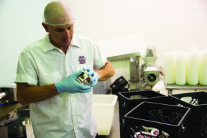 Man makes butter in the Custer Dairy Processing Plant